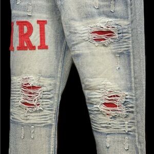 AMIRI Light Blue Distressed Jeans with Red Details